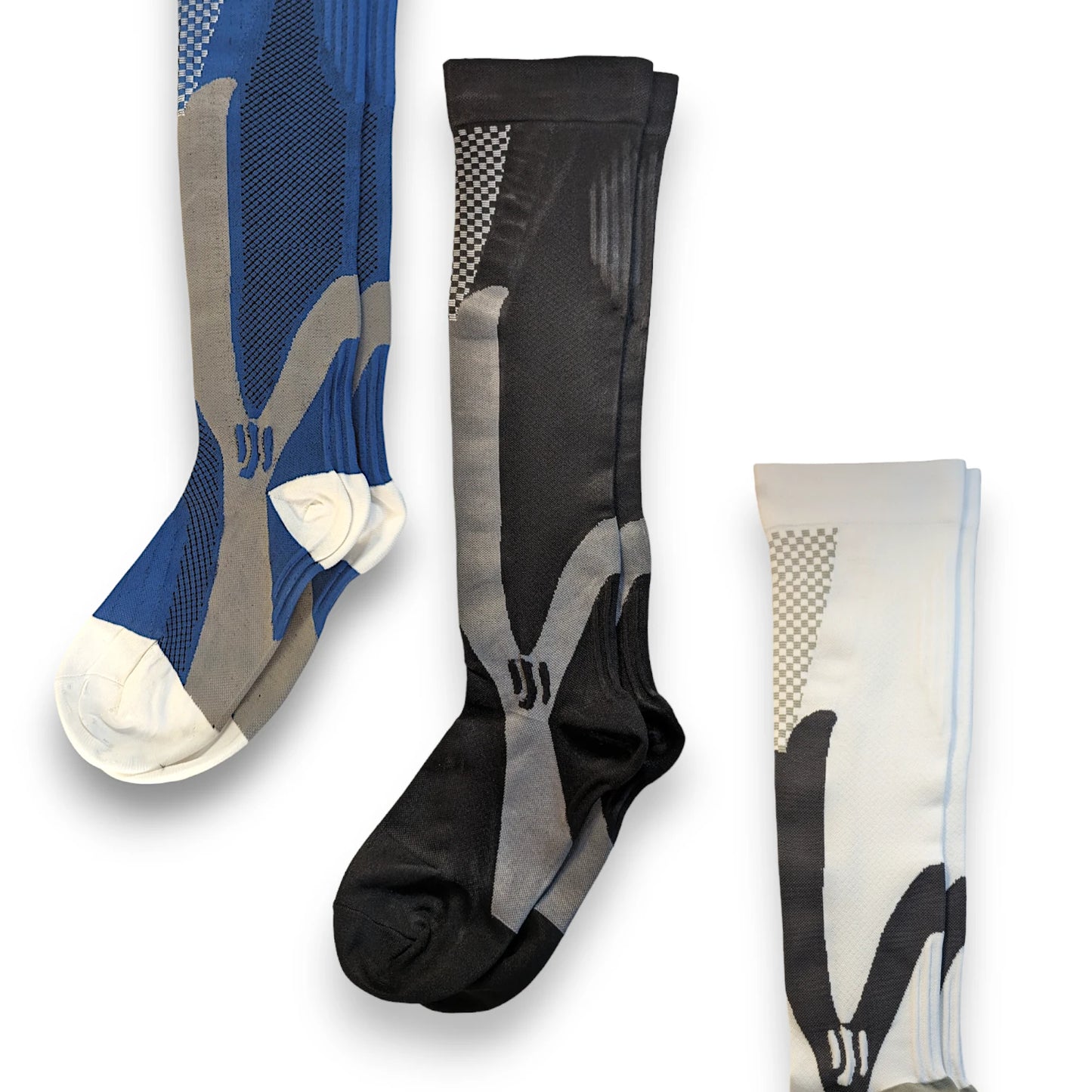 Three pairs of sports compression socks, one blue, black and white.