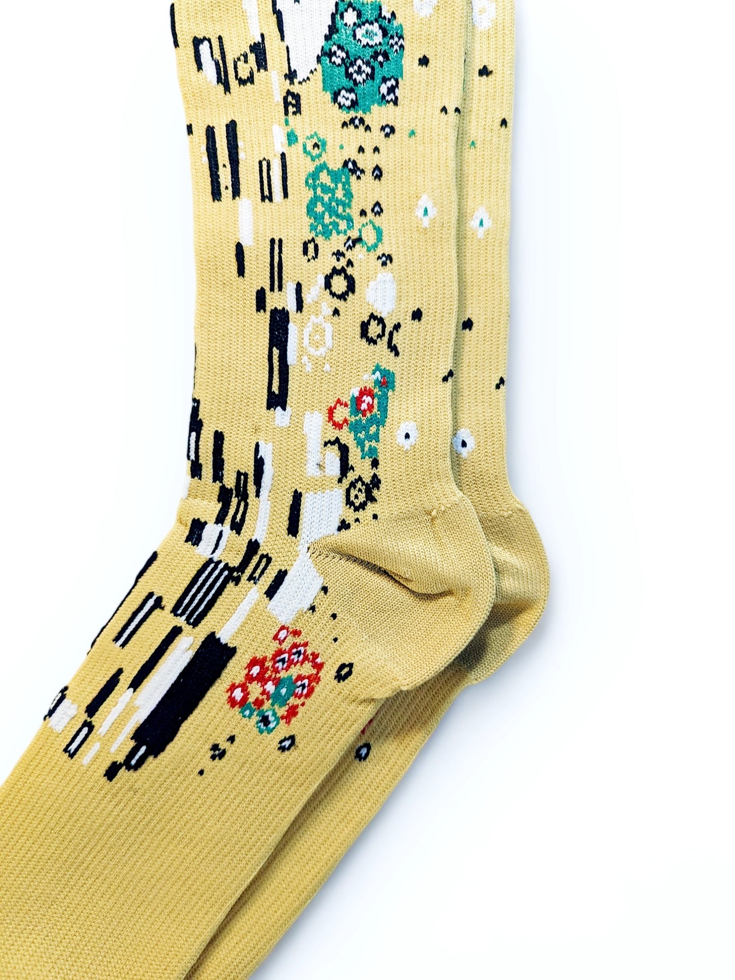 Heel of a pair of yellow compression socks with the famous painting 'Kiss' printed on it.