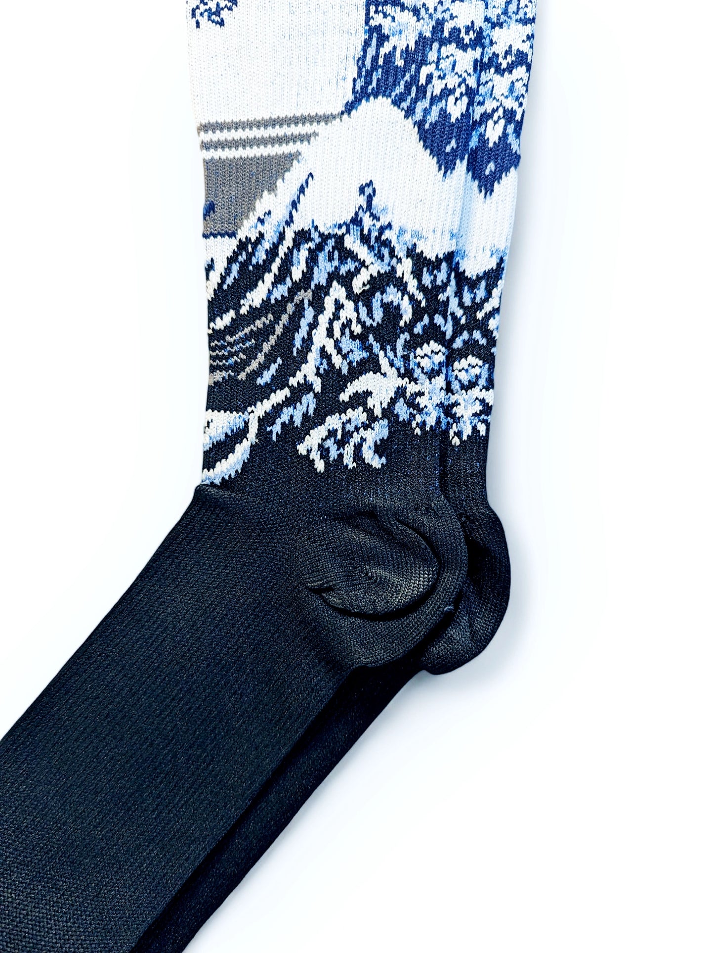 A pair of blue Compression Socks, heel view