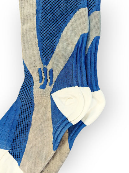 The heel of a pair of blue sports compression socks