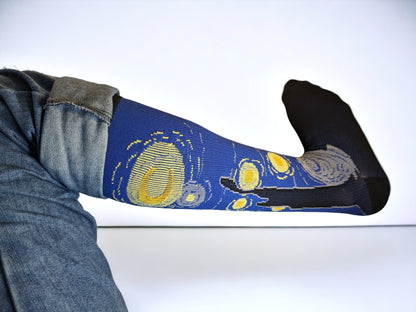 A leg wearing blue compression socks facing sideways