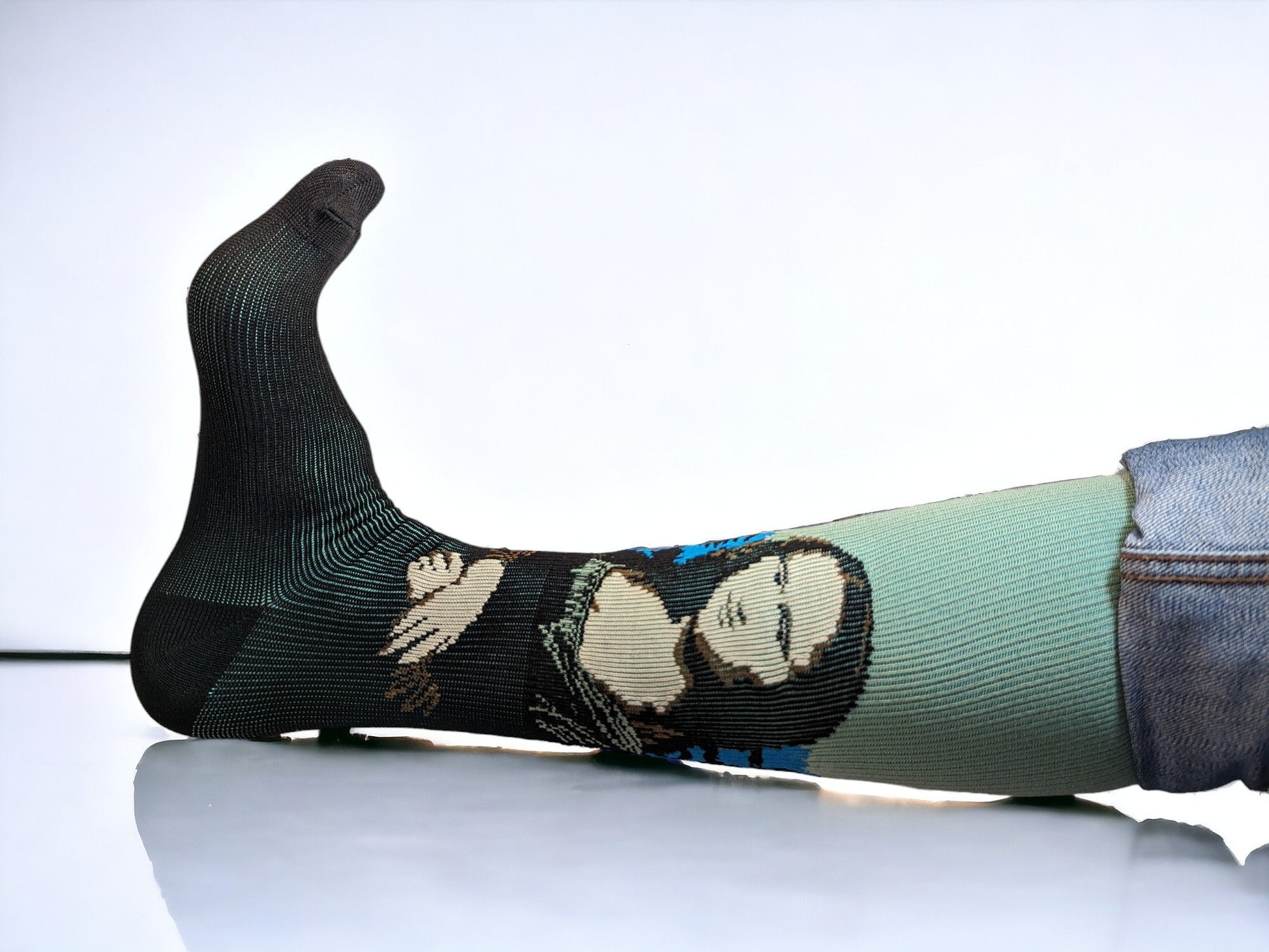 A leg wearing green compression socks facing sideways