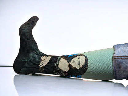 A leg wearing green compression socks facing sideways