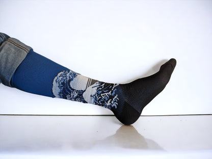 A leg wearing blue compression socks facing sideways
